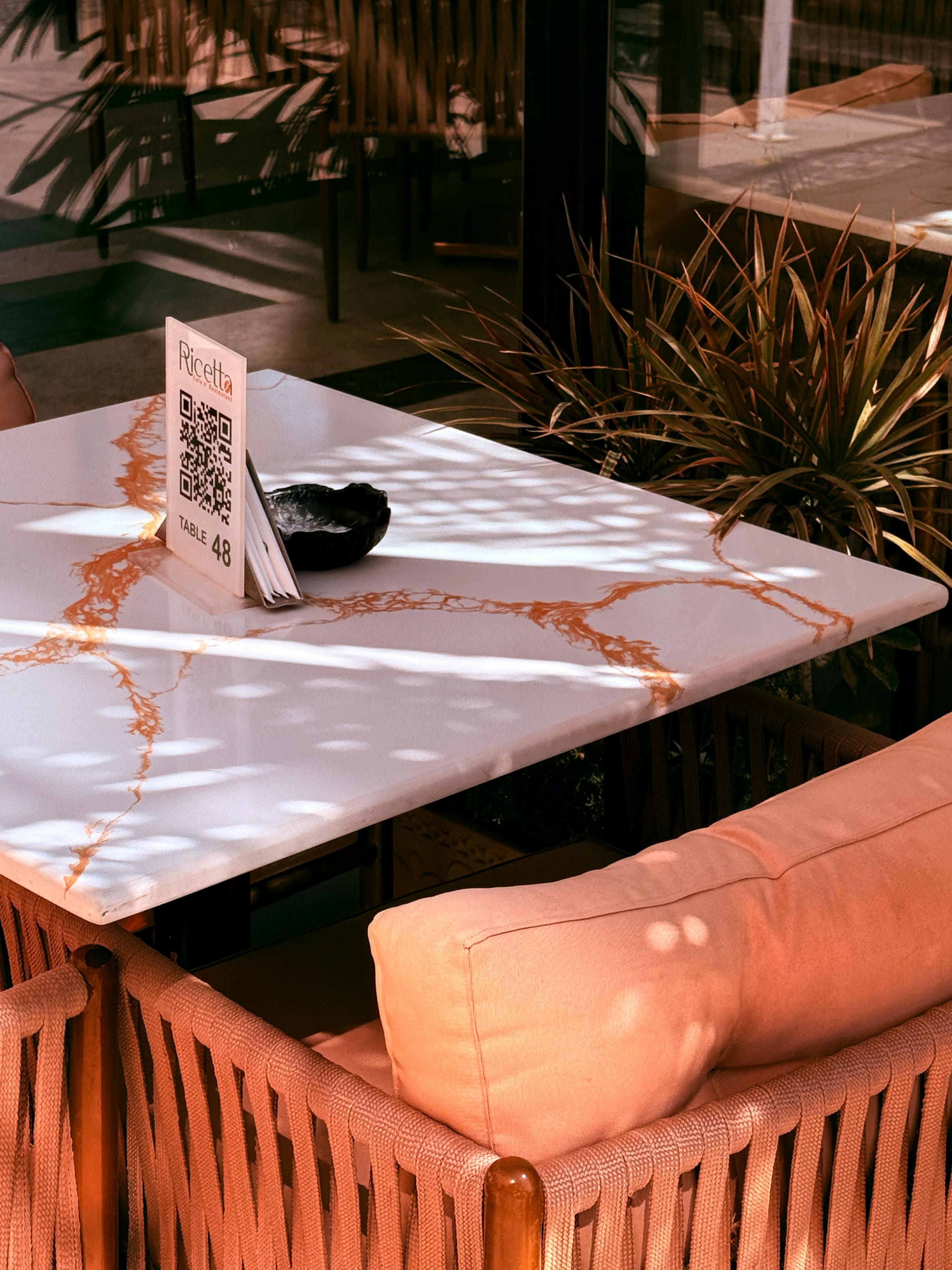 Restaurant table setup featuring a QR code marker for ordering