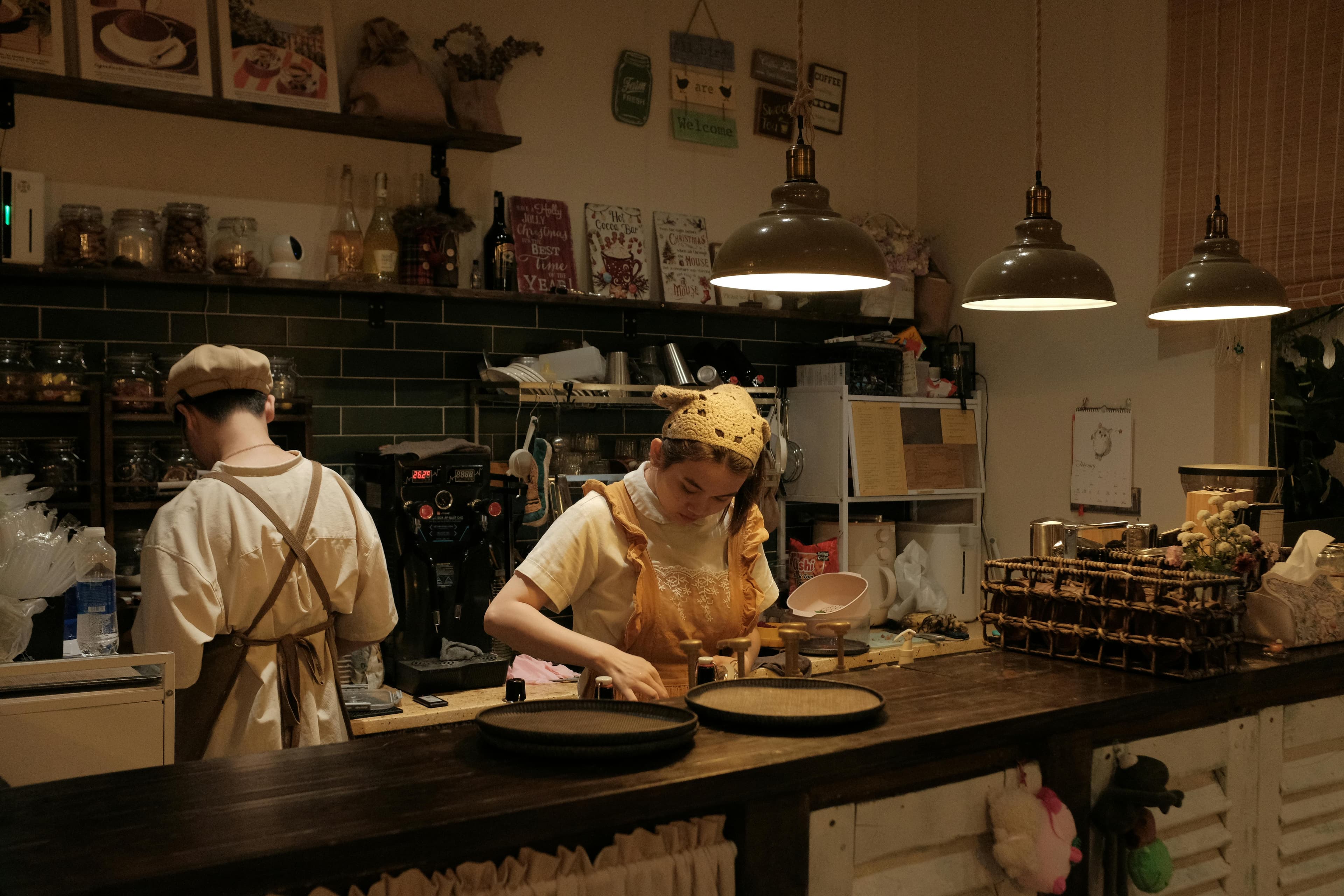 Cafe staff preparing orders behind the counter